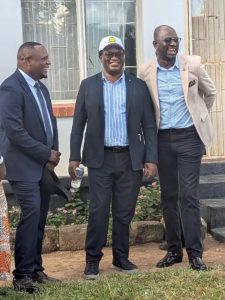 Hon. Binwell Chansa Mpundu laughs with fellow opposition figures at a Tonse Alliance coalition gathering in Zambia, 2026